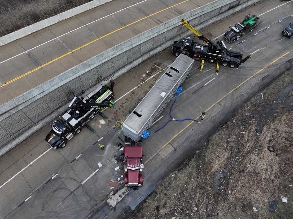 Rotators working a bus recovery on a roadway