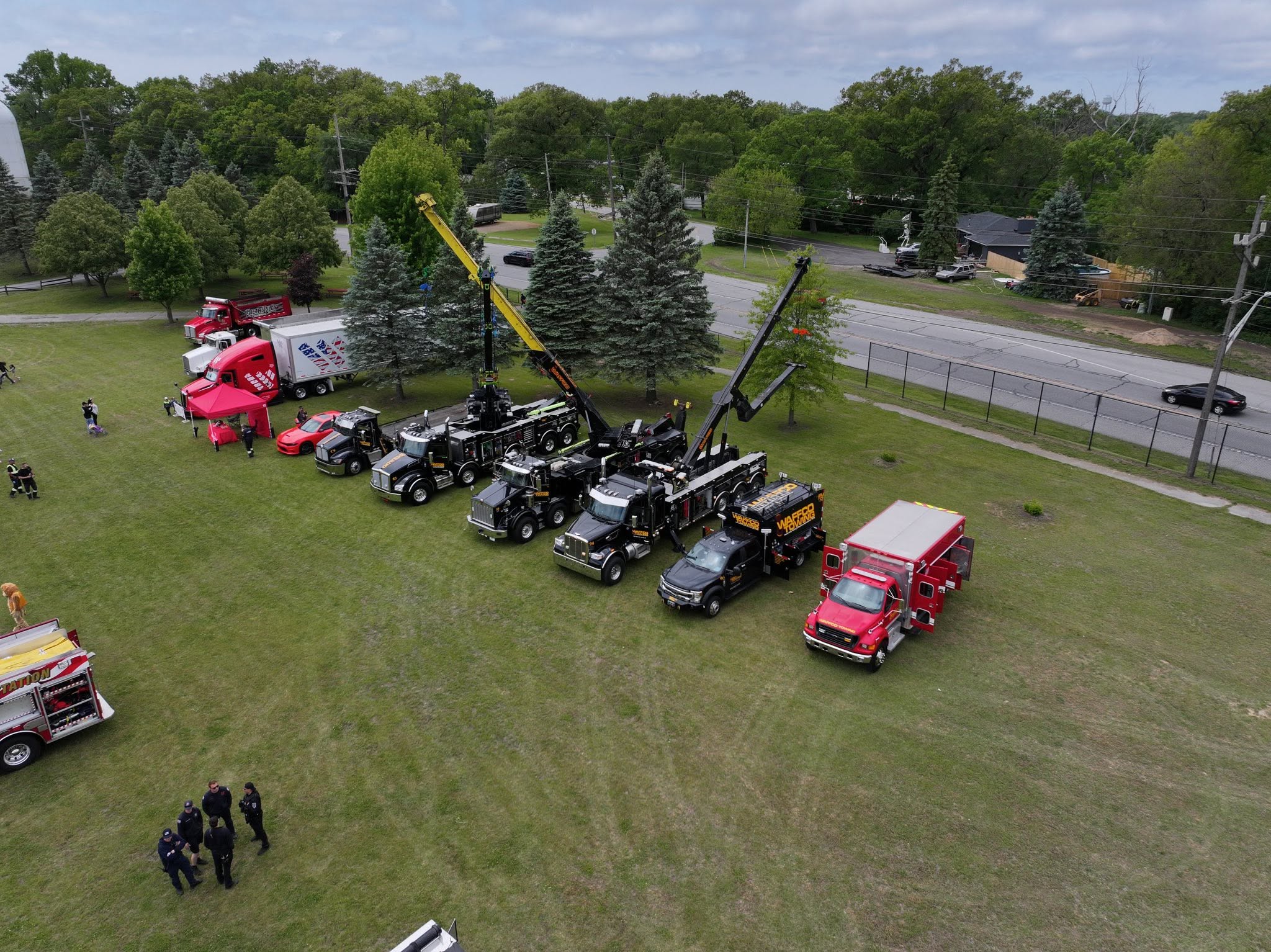 Waffco heavy trucks and rescue support vehicles displayed on grass