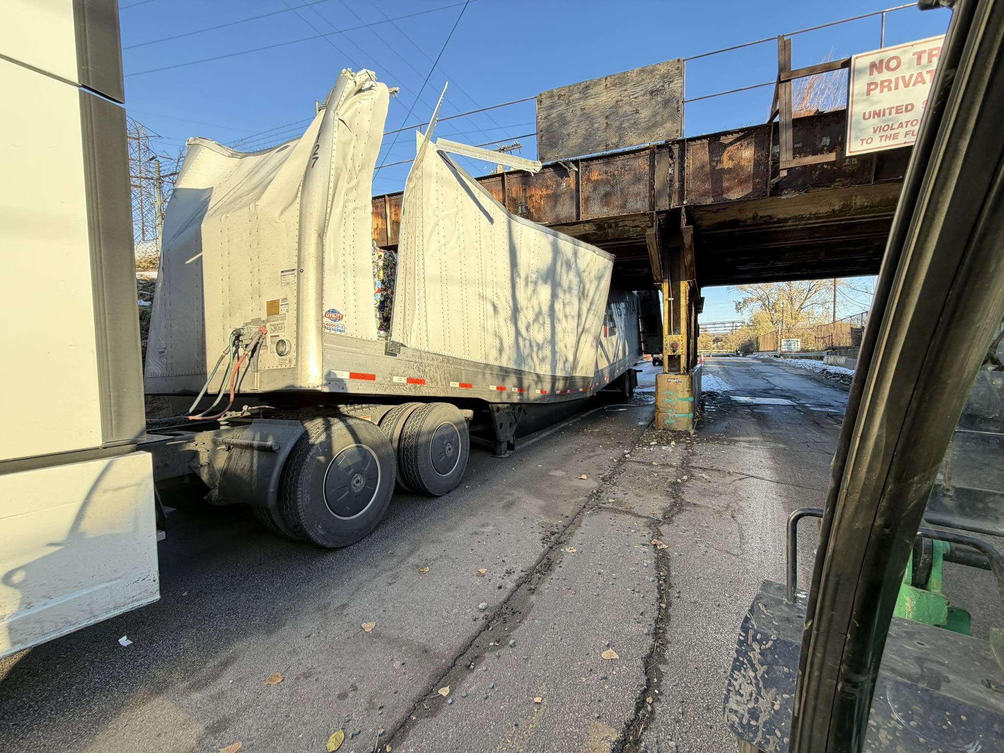 Trailer damaged under a low bridge