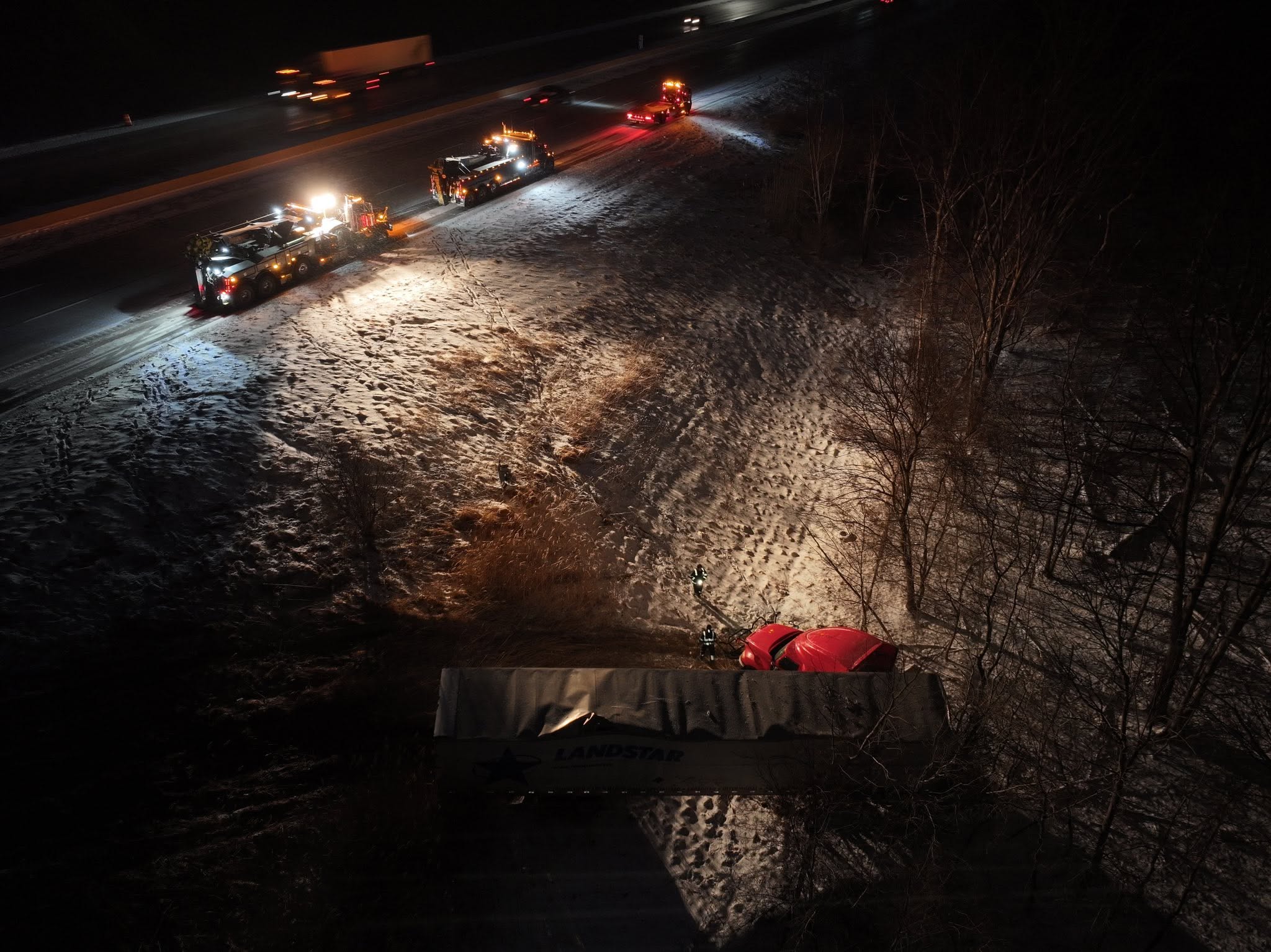 Waffco recovery trucks working a snowy off-road trailer recovery