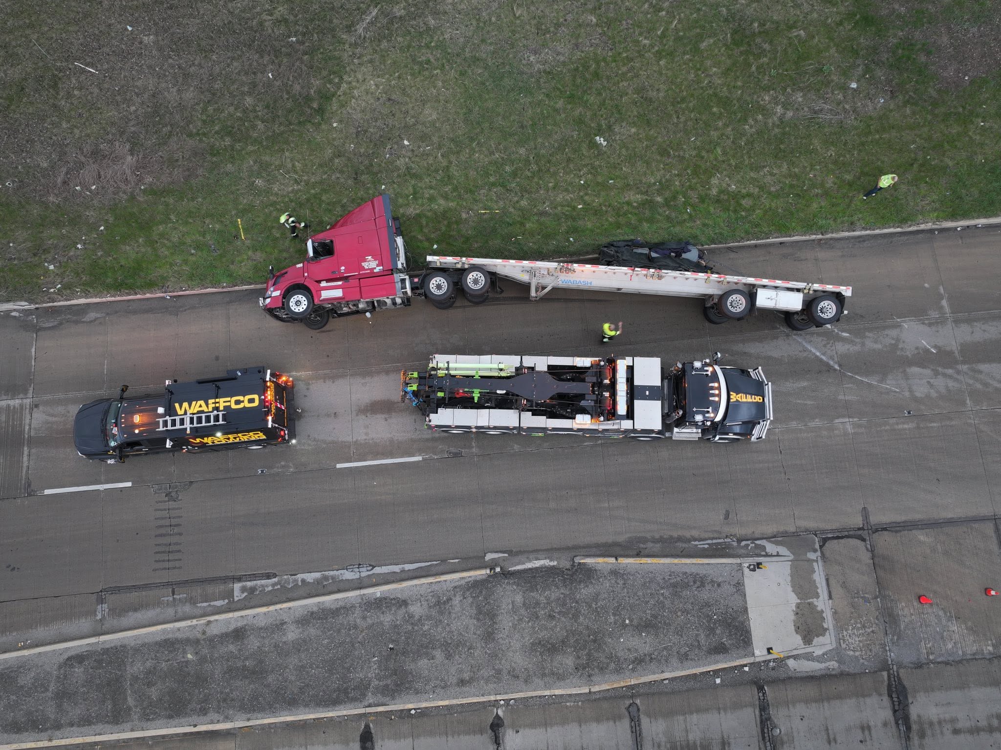 Overhead view of flatbed tractor recovery with Waffco equipment