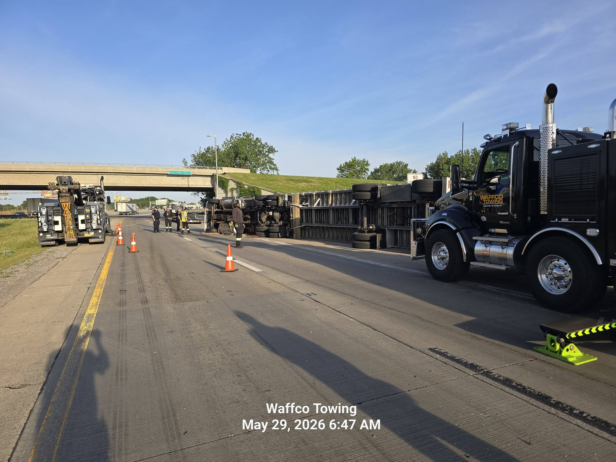 Overturned trailer recovery with Waffco wreckers on the roadway