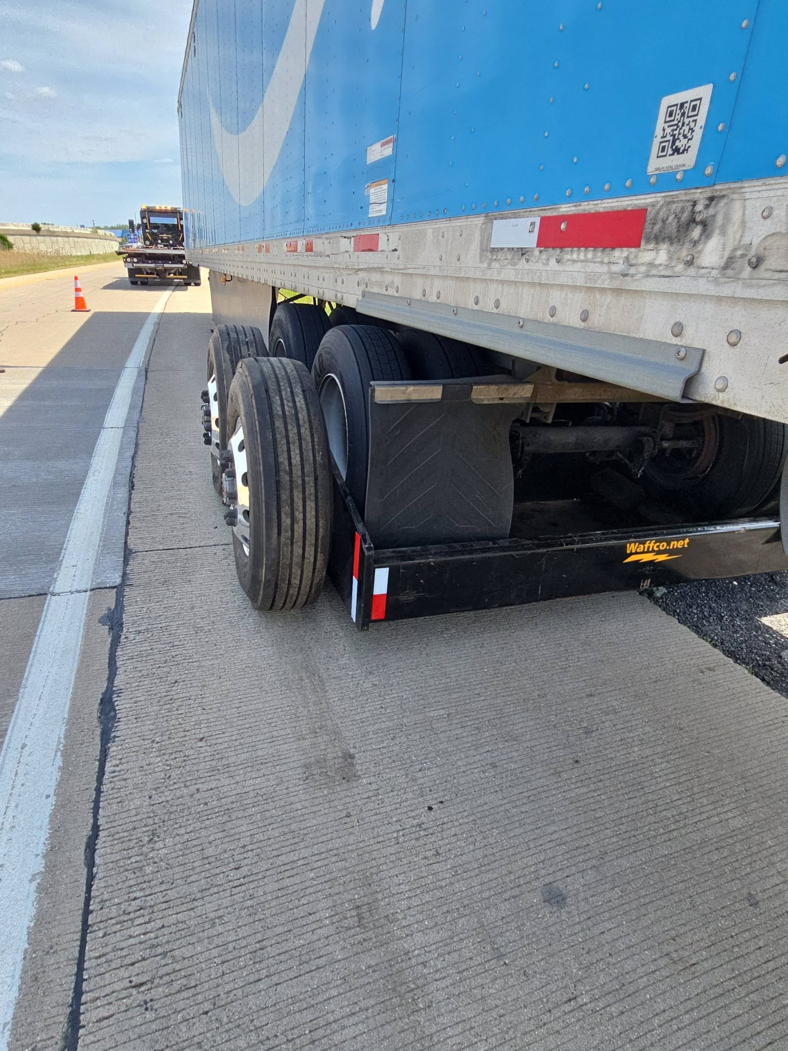 Trailer support with Waffco mudflap visible